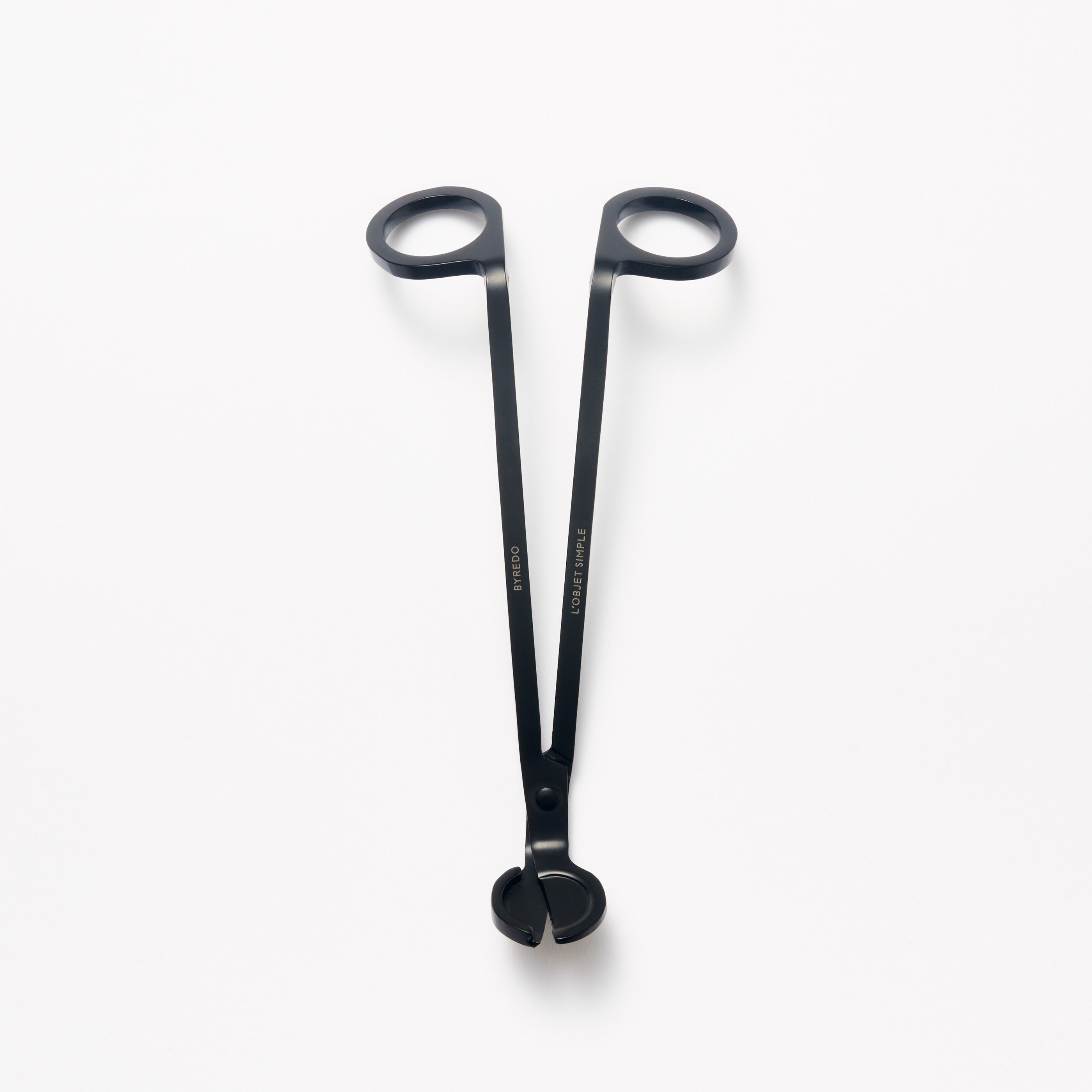 Byredo’s black wick trimmer, shown open