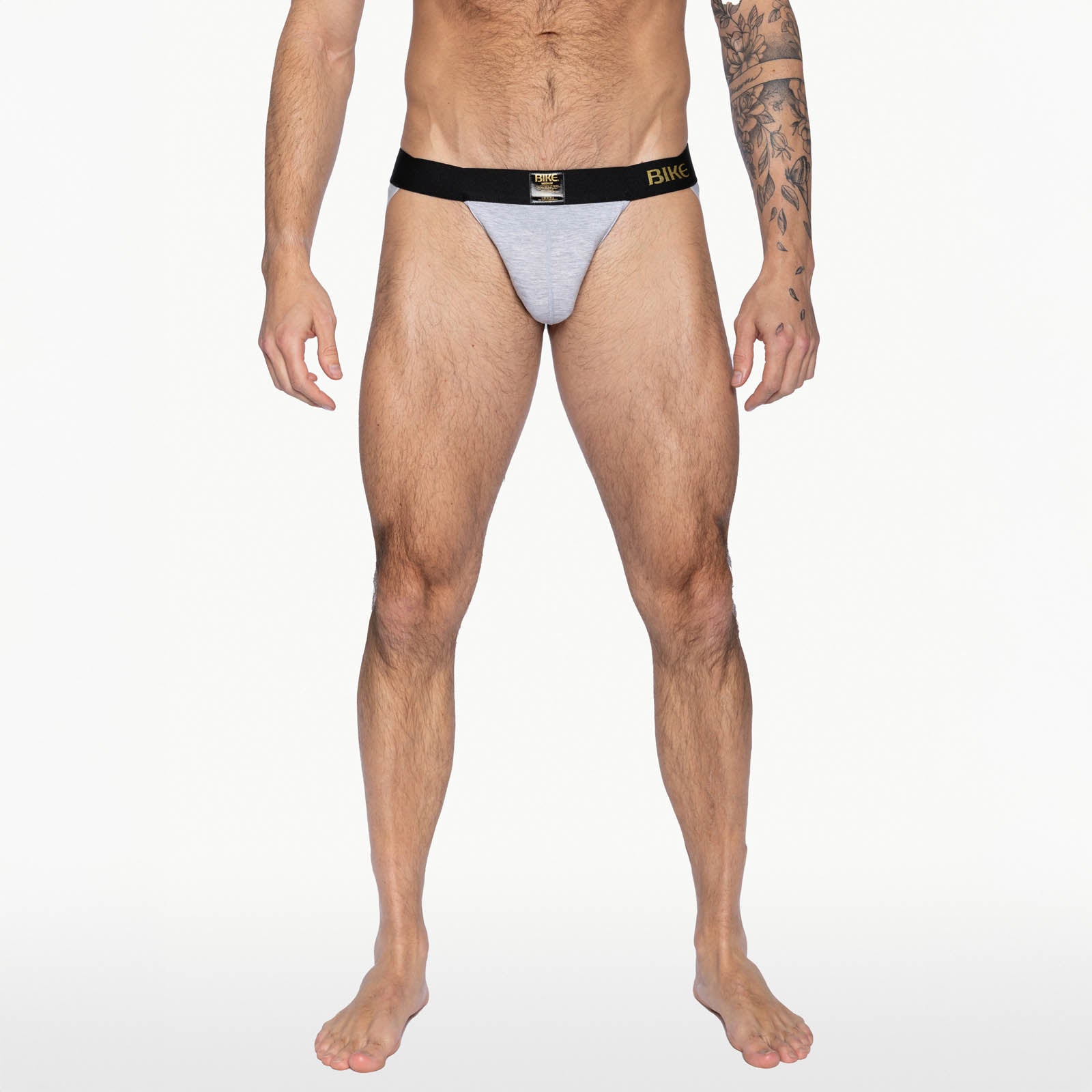 Adult model wearing the BIKE Active Jockstrap in light grey with a black waistband