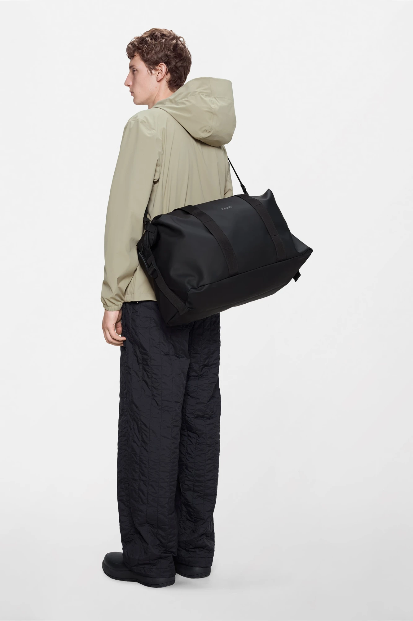 Open Patagonia Berry Fig duffel packed with a small selection of clothing.