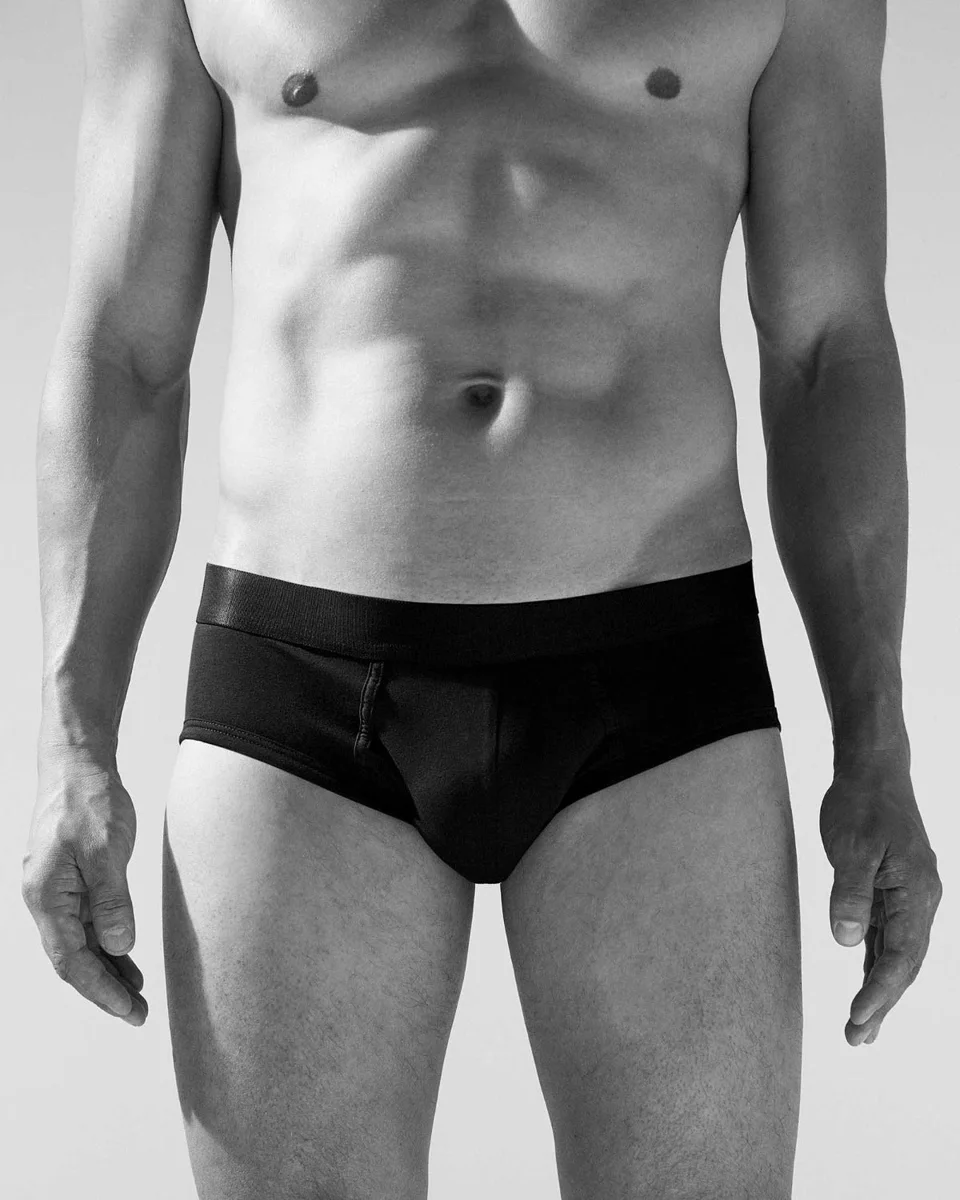 Adult male model wearing CDLP Y-Brief, three-pack in black