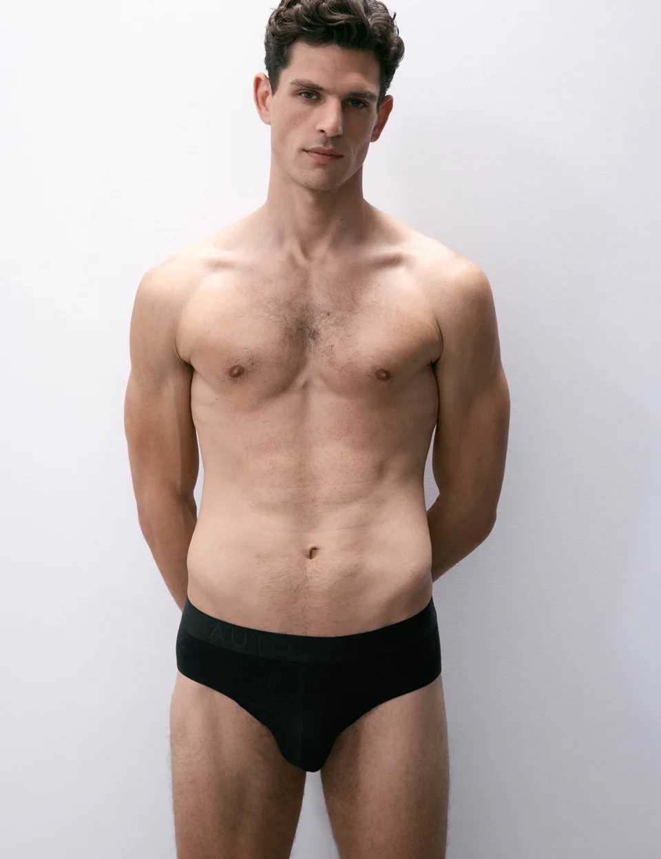 Adult male model wearing M&S AUTOGRAPH Modal Stretch 360 Flex Briefs in black