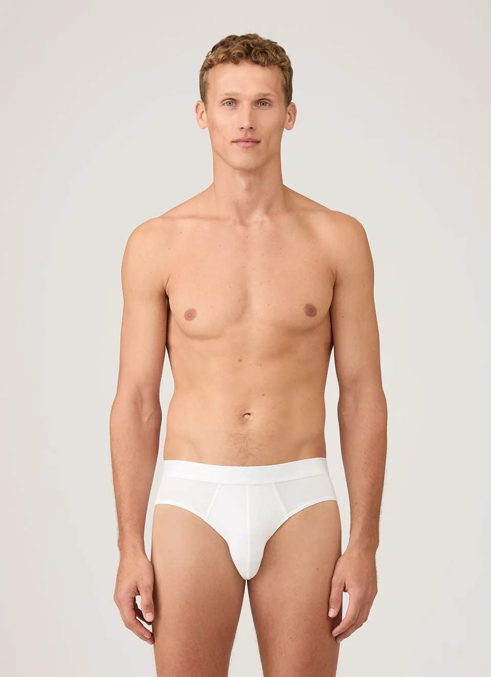 Adult male model wearing SUNSPEL Stretch Cotton Briefs in white