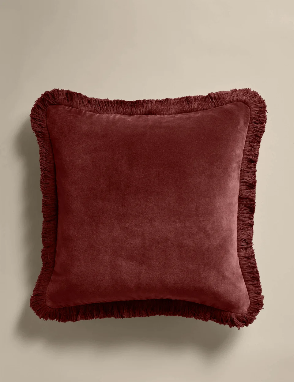 Burgundy fringed M&S cushion