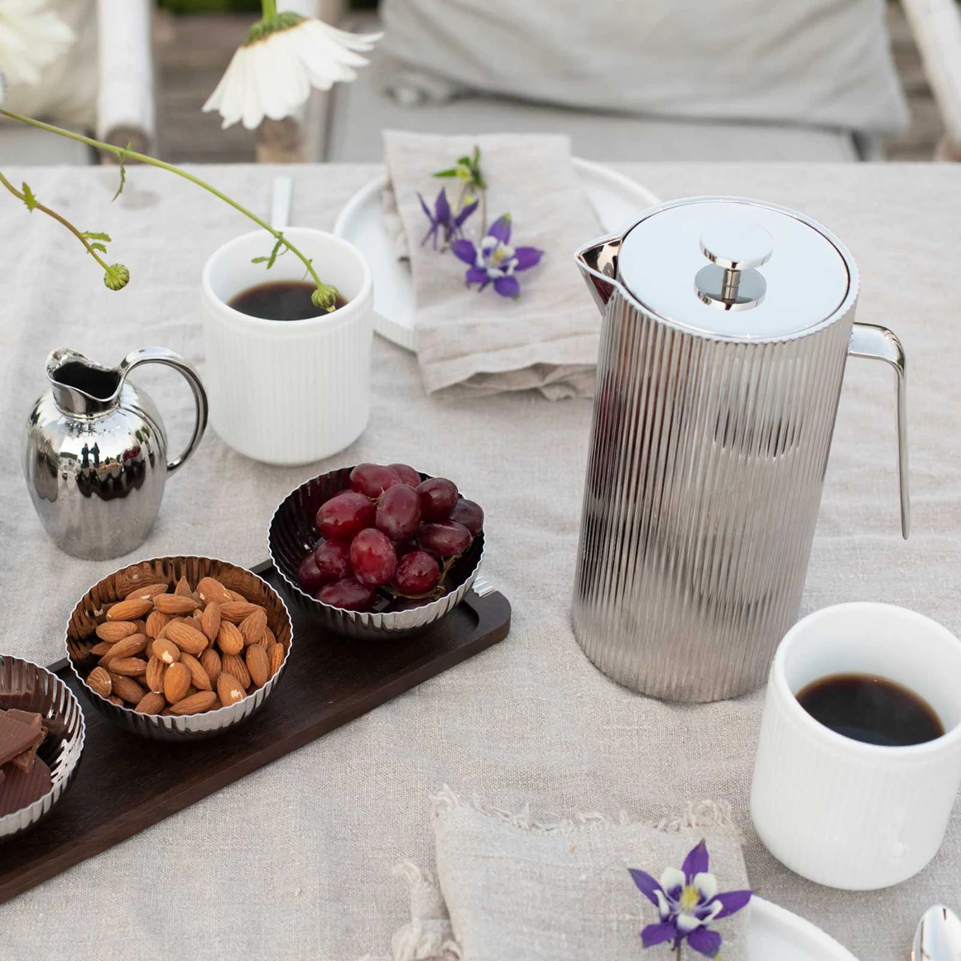 Georg Jensen coffee press on a laid table