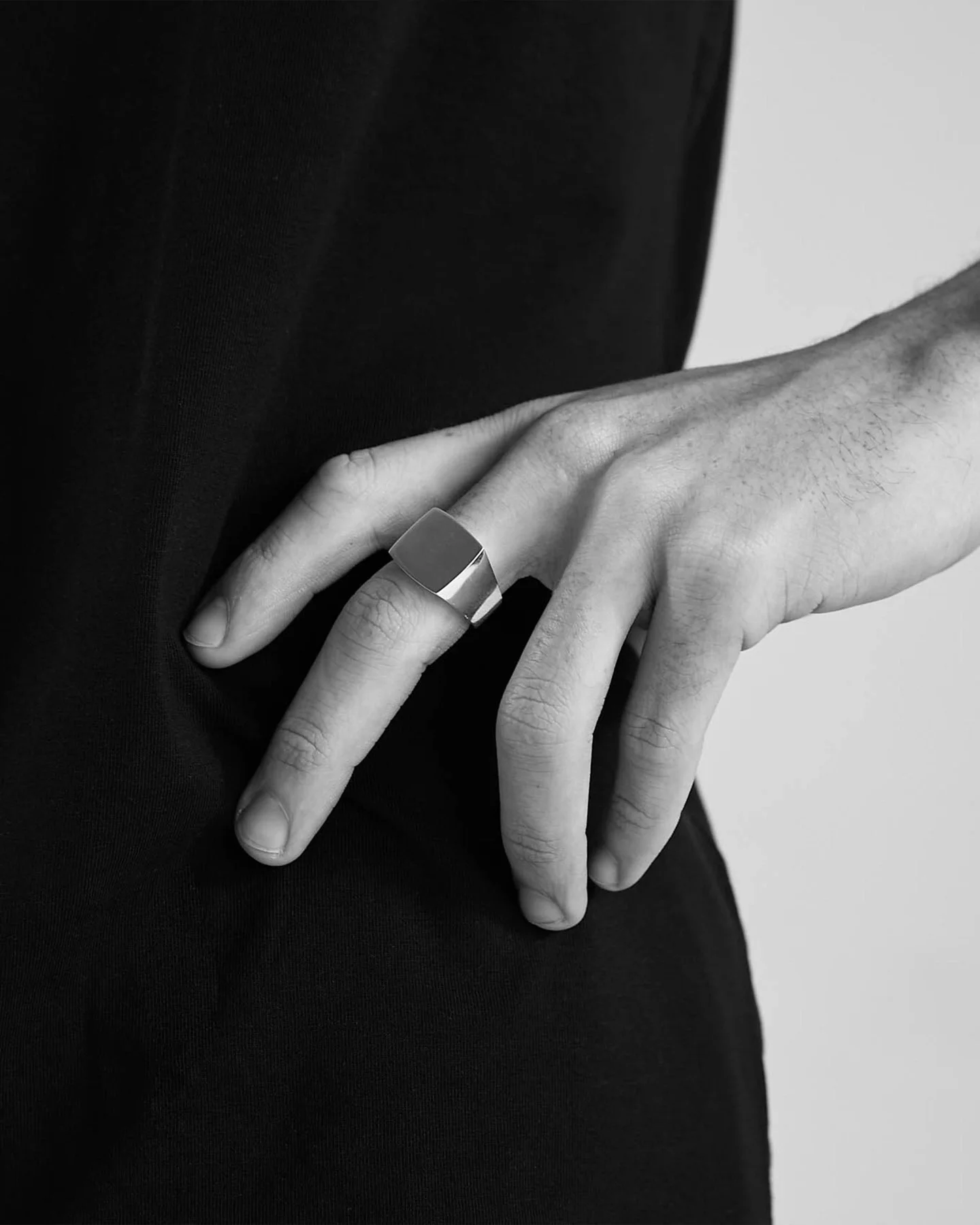 Daniel Simmons silver signet ring, worn in original brand photography.