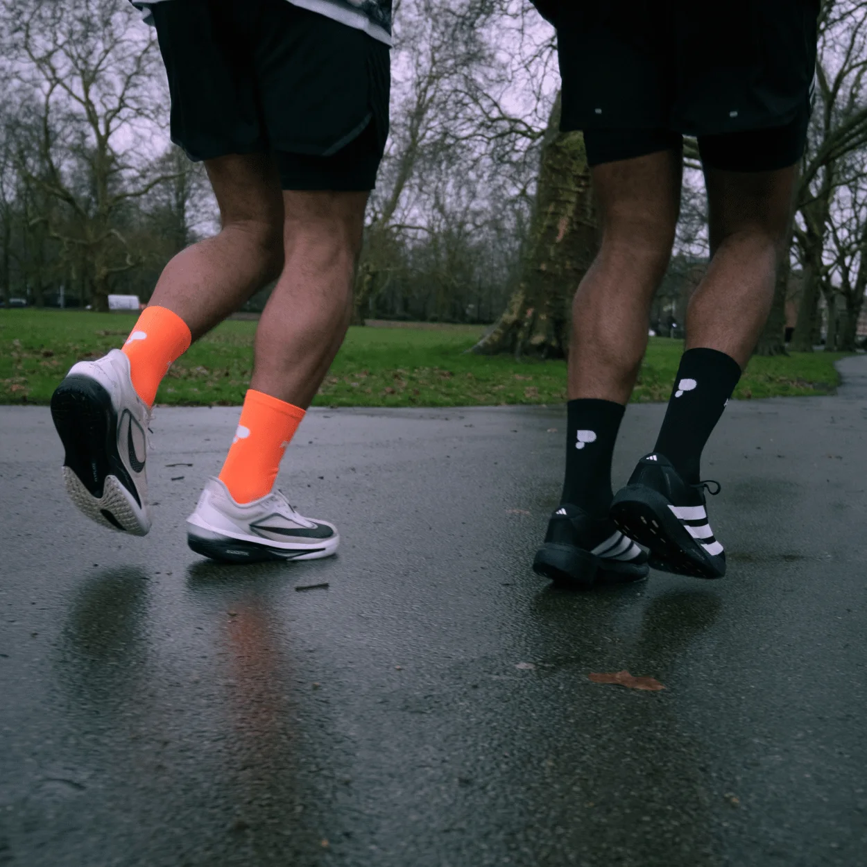 Runners in performance socks and trainers, photographed by Puresport.